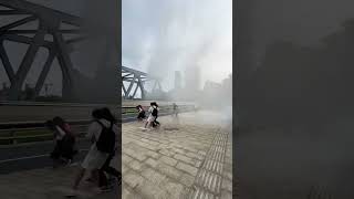 Tide of Qiantang River showers spectators on bridge [upl. by Asilef]