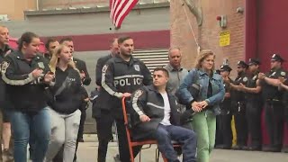 NYPD officers released from Queens hospital to standing ovation after shooting [upl. by Lilak]