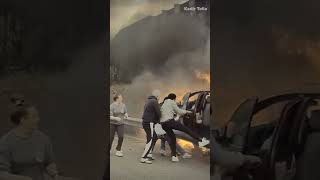 WHOA Good Samaritans save driver from burning car [upl. by Nahbois]