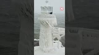 Winter Storm Covers Historic Lake Michigan Lighthouse In Ice [upl. by Jessey]