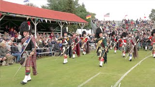 Drum Majors lead the Massed Pipe Bands marching past stands at 2022 Braemar Gathering in Scotland [upl. by Anifur]