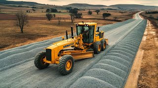 The technique of rural road construction process with a heavy motor grader pushing gravel road base [upl. by Calendra]