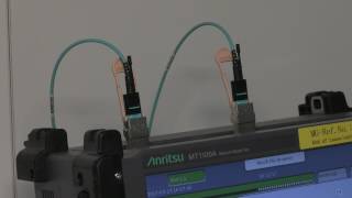 Finisar Demonstrates 100G QSFP28 eSR4 Transceiver at OFC 2017 [upl. by Ahsirhcal]