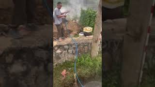 The process of irrigating fields with a portable water pump [upl. by Eyks]