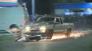 Pickup plows through protester crowd drags motorcycle [upl. by Alohs335]