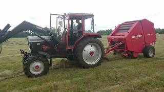 MTZ825 with Welger RP15 baler [upl. by Lisetta]