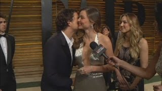 AWKWARD Orlando Bloom interrupts Miranda Kerrs interview at Vanity Fair Oscars party [upl. by Ahseyn]