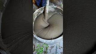 Construction worker mixing plaster coating with mixer [upl. by Truc56]