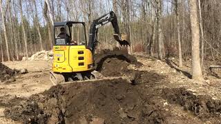 John Deere 35g digging some rocky ground test pits for a new foundation [upl. by Corsiglia]