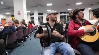 Flight delayed so famous Irish musicians play for the passengers in jam session [upl. by Ettenahc]