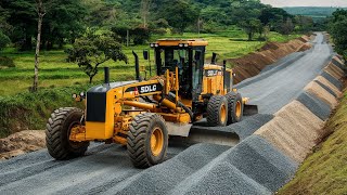 The main technology yellow motor grader machine with the brand SDLG Making pushes layers of gravel [upl. by Simmie]