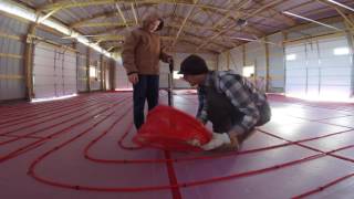 Pole Shed  Installing radiant floor heat PEX tubing loops with a foam board stapler [upl. by Garmaise]