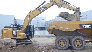 Dumpers CAT 730C load by CAT 330F [upl. by Gonick342]