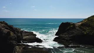 As the wave breaks on the rocks water becomes foamy as it rushes into a rocky inlet FREE STOCK VIDEO [upl. by Einohtna917]