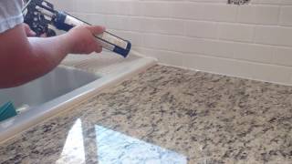 How to install silicone caulk around kitchen countertop shower bath tub etc [upl. by Barker]