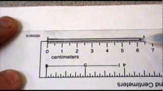 Measuring to the nearest cm and mm [upl. by Drawe]