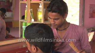 A barber giving a haircut in India [upl. by Dhumma]