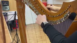 Winding on a harp string  real time tutorial  how to change a harp string [upl. by Siulesoj968]