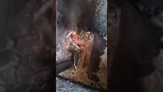 Loading a WoodMaster CleanFire Outdoor Wood Boiler [upl. by Rehtnug]