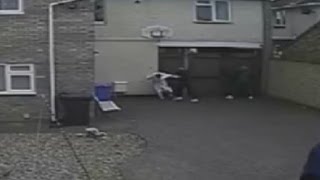 Horrific moment woman in dressing gown is punched as she tackles burglars [upl. by Fuller158]