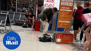 EasyJet passenger destroys his luggage to avoid excess baggage fee [upl. by Lein]