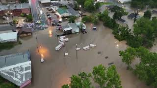 WATCH Drone video shows submerged trucks UHauls buildings in Livingston along Highway 59 [upl. by Bristow706]