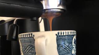 Pulling a shot of espresso through my Delonghi ec155 modded with a bottomless portafilter [upl. by Ecahc]