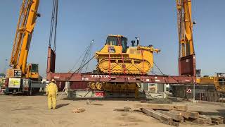 Liebherr LTM 110 ton crane lift the Komatsu 155A dozer on the open container to load on the trailer [upl. by Eelynnhoj]