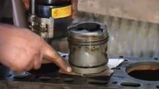 Using a Piston Ring Compressorwmv [upl. by Schreiber]