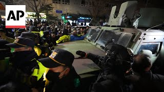 People block military vehicle trying to leave area near South Koreas parliament [upl. by Asilrak117]