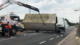 Watch as overturned lorry is dragged off new car display [upl. by Dnalrah]