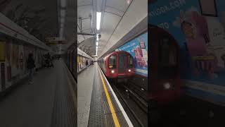 2 central line train heading at London underground station of Tottenham Court Road [upl. by Nwahsyt]