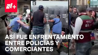 Policías repliegan bloqueo de comerciantes entre elotazos golpes y jaloneos en Eje Central [upl. by Anaher52]