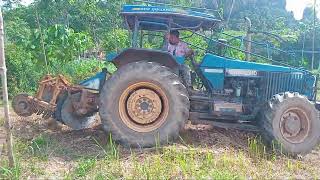 Tractor Tiller Working In Rubber Plantation [upl. by Nnalatsyrc]