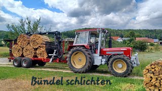 Holzbündel stapeln mit Rückewagen und Schlüter [upl. by Saire674]