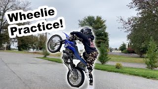 WHEELIES ON A YAMAHA TTR125  she crashed a few times [upl. by Kramnhoj]