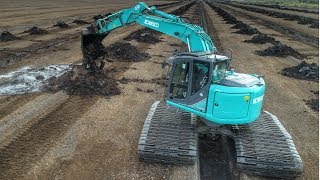 Cleaning out Bog Drains with V bucket [upl. by Airehc]