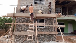 Building in Ghana 🇬🇭 installation of Natural Stone Cladding in central region [upl. by Arvin376]