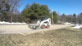 Bobcat S250 Sweeping Driveway [upl. by Otrebogad734]