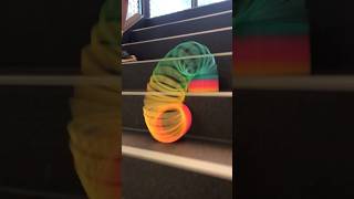 Giant slinky rolling down the stairs slinky satisfying shorts [upl. by Reggy]