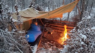 Winter Camping in Snow Storm with Survival Shelter amp Bushcraft Cot [upl. by Indys]