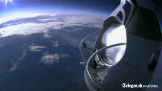 Daredevil skydiver Felix Baumgartner completes death defying leap from 18 miles up [upl. by Nefets]