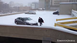 Driver frees himself from snowy parkade [upl. by Israeli]