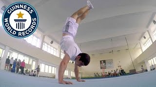 Most handstand push ups in one minute  Guinness World Records [upl. by Andros]