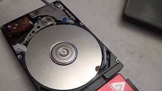 Take a look inside a hard drive while its running [upl. by Kono643]