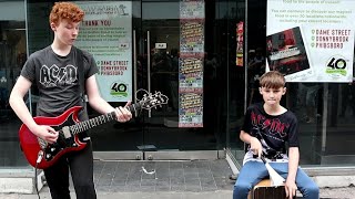 As ACDC Arrive in Dublin For a Concert Brothers Liam amp Adam Curran Perform One of Their Hits [upl. by Llewkcor]