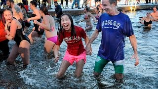 Polar Bear Plunge cofounder introduces daughter to the cold waters [upl. by Ydnas]