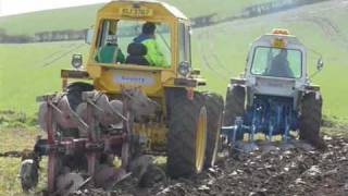 county 1174 tractors ploughing in formation [upl. by Inattyrb]