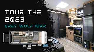 Tour the 2023 Grey Wolf 18RRBL Travel Trailer Toy Hauler [upl. by Rialcnis610]