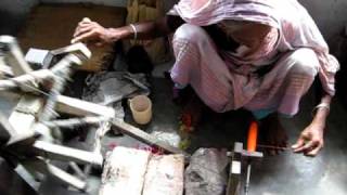 Ladies winding cotton on to bobbins at Thanapara Swallows Development Society [upl. by Annaer666]